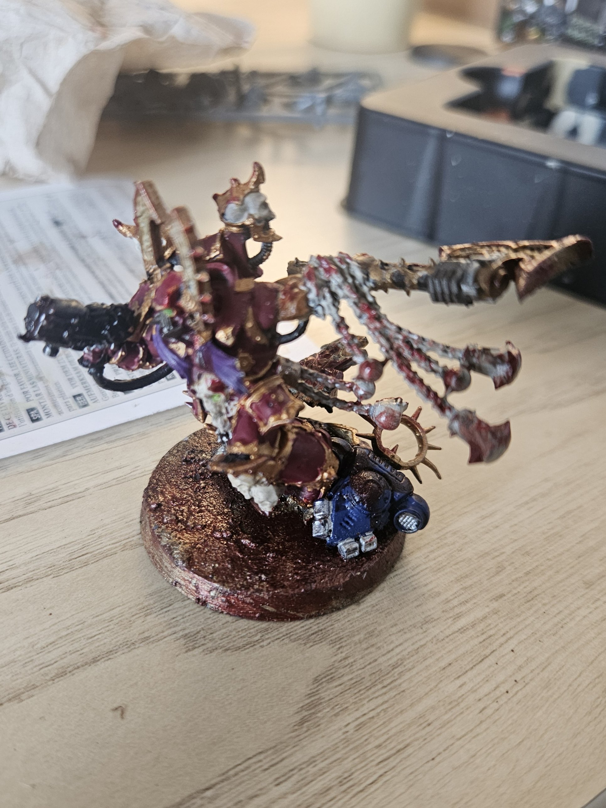A hand-painted Warhammer 40k miniature on a textured base.